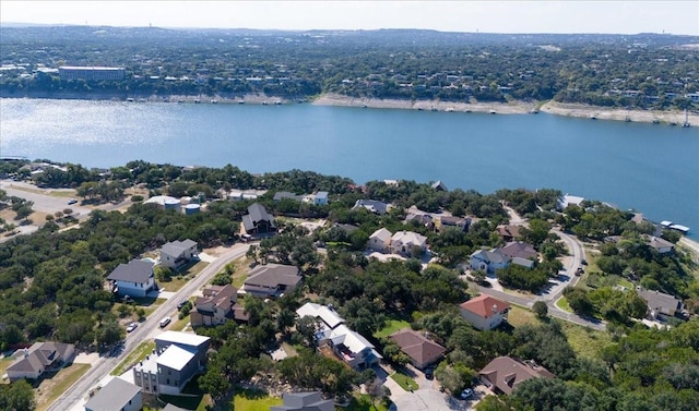 drone / aerial view featuring a residential view and a water view