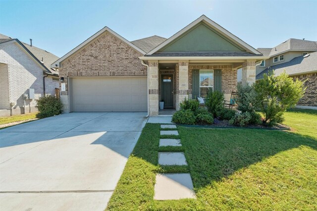 view of front of house with a garage and a front yard