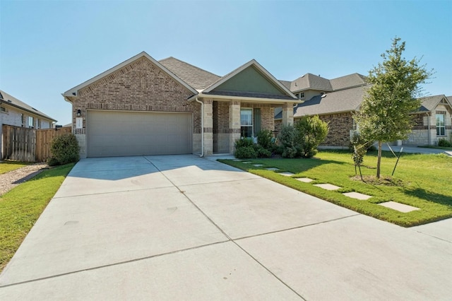 ranch-style home with a front lawn, fence, brick siding, an attached garage, and driveway