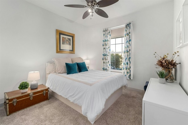 bedroom featuring ceiling fan and light colored carpet