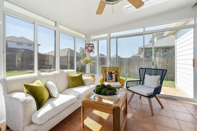 sunroom / solarium with a ceiling fan