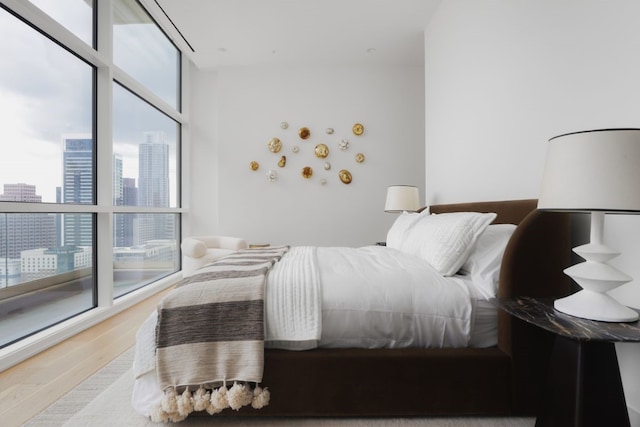 bedroom with hardwood / wood-style floors