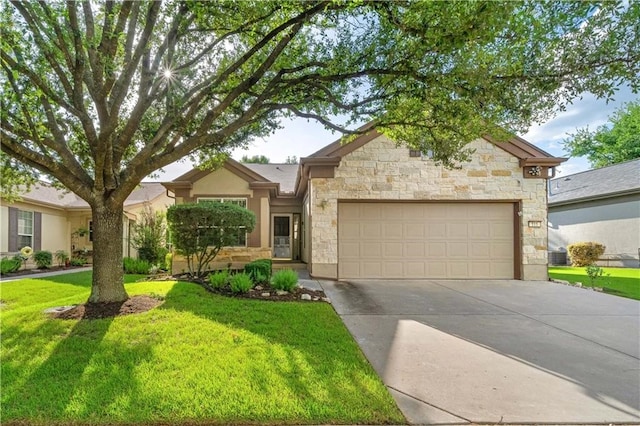 view of front of home featuring a front yard and a garage