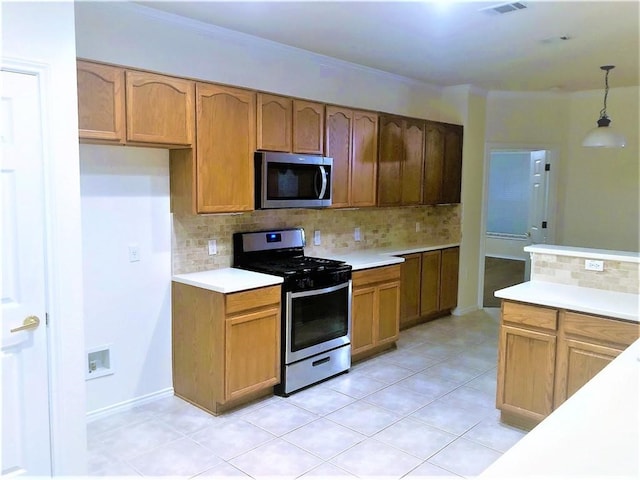 kitchen featuring decorative light fixtures, stainless steel appliances, ornamental molding, and decorative backsplash