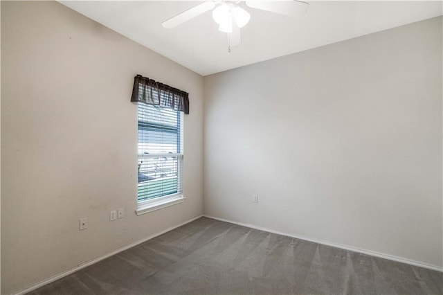 unfurnished room featuring ceiling fan and carpet