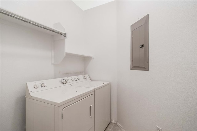 laundry room with electric panel and independent washer and dryer