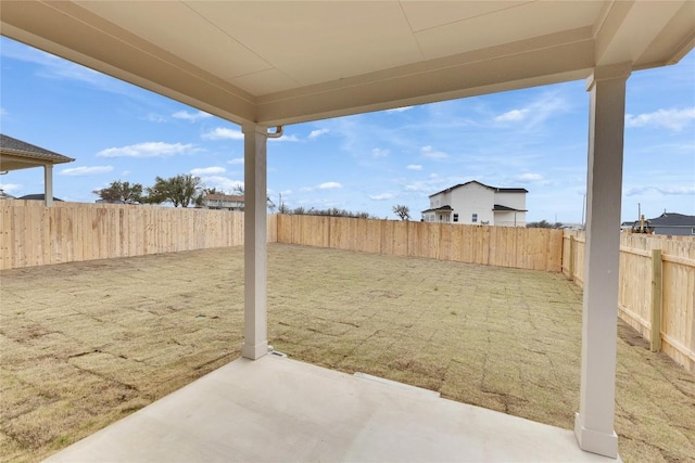 view of yard with a fenced backyard and a patio