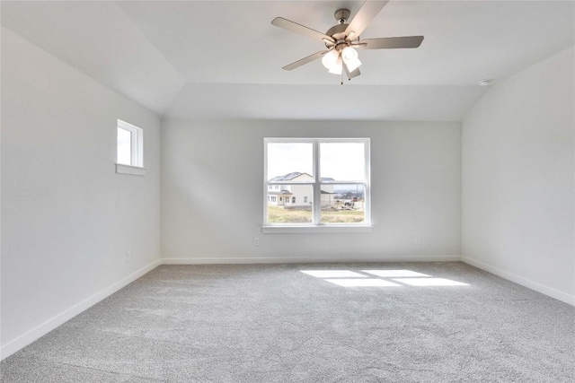 unfurnished room with plenty of natural light, baseboards, and carpet floors