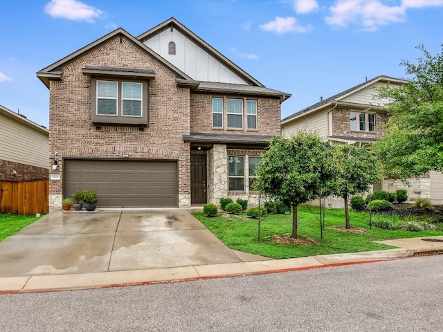 view of front of house with a garage and a front lawn