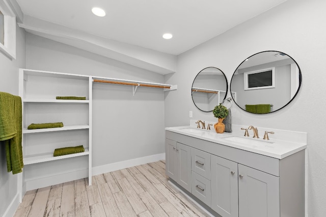 bathroom with vanity and hardwood / wood-style floors