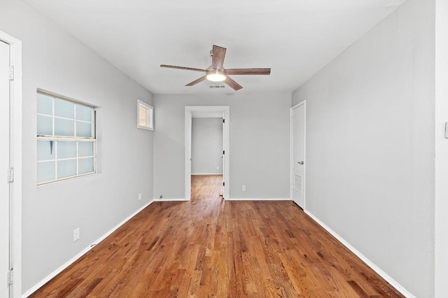 1708 Payne Ave, Austin, TX 78757 - spare room with wood finished floors, ceiling fan, and baseboards