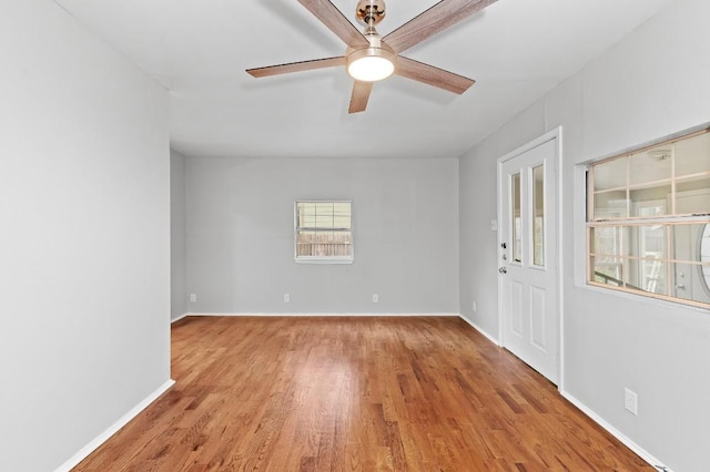 1708 Payne Ave, Austin, TX 78757 - unfurnished room with a ceiling fan, wood finished floors, and baseboards