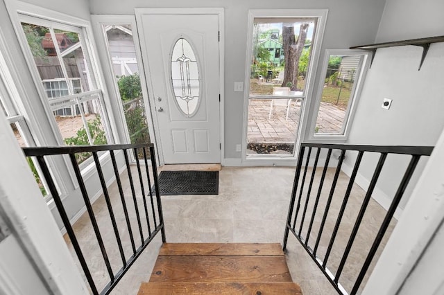 1708 Payne Ave, Austin, TX 78757 - foyer with healthy amount of natural light, stairway, and baseboards