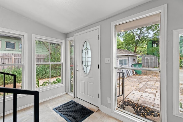 entrance foyer featuring vaulted ceiling