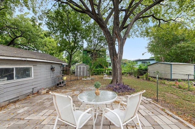 wooden deck featuring a patio and a shed