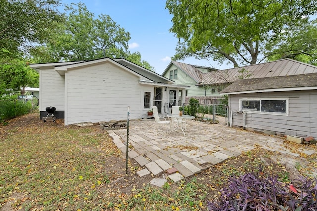 rear view of house featuring a patio area