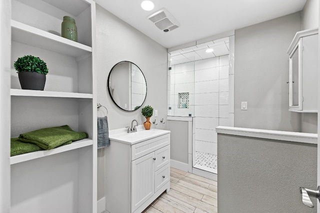 bathroom featuring vanity and hardwood / wood-style floors