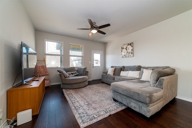 living room featuring dark hardwood / wood-style flooring and ceiling fan