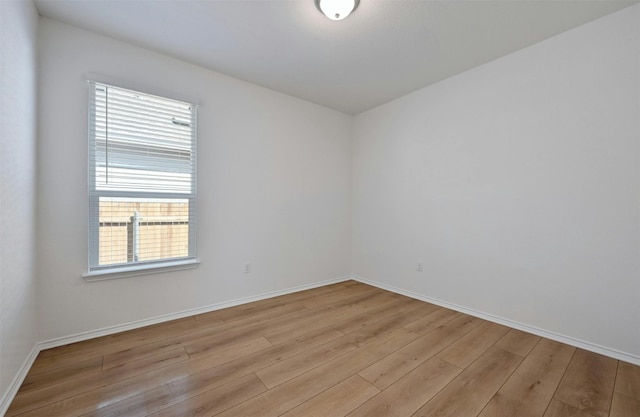 unfurnished room with light hardwood / wood-style floors