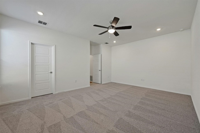 empty room featuring light carpet and ceiling fan