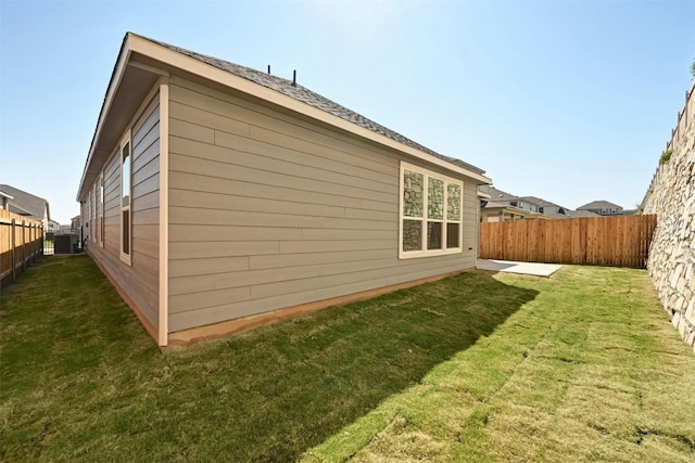 view of property exterior with a lawn