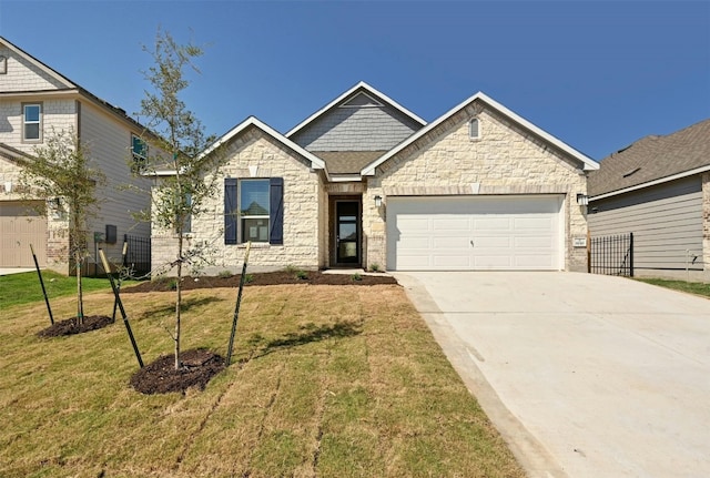 craftsman inspired home featuring a garage and a front yard