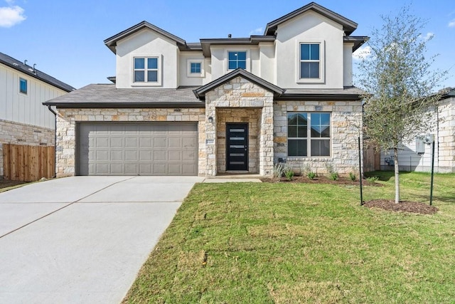 view of front of home featuring a front yard and a garage