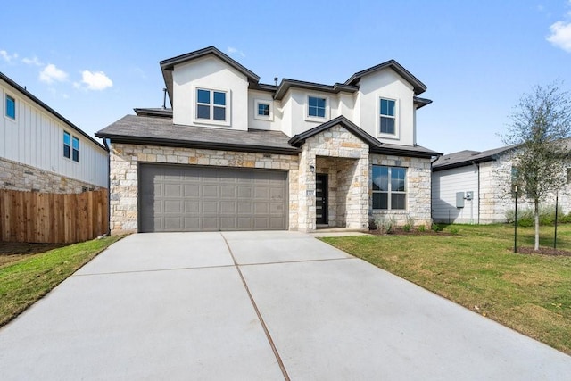 view of front of home with a garage and a front yard