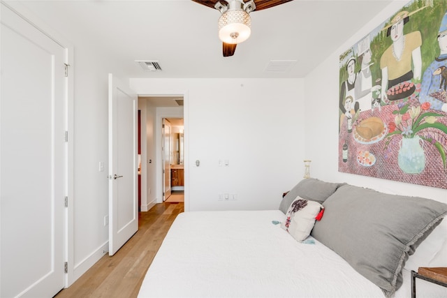 bedroom with light wood-type flooring and ceiling fan