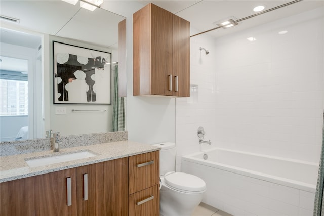 full bathroom with tiled shower / bath combo, tile patterned flooring, vanity, and toilet