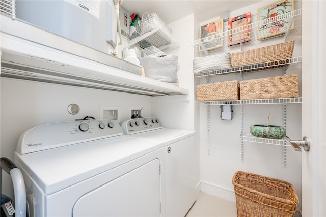 laundry area with independent washer and dryer