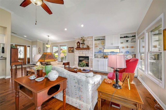 14 Par View Dr, Wimberley, TX 78676 - living room featuring vaulted ceiling, wood finished floors, a ceiling fan, a fireplace, and ornamental molding