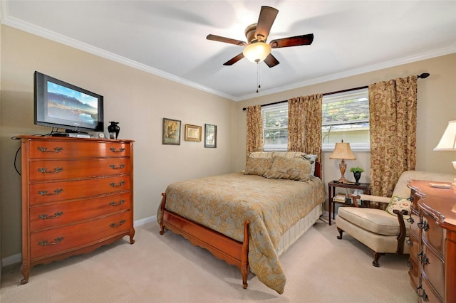 bedroom featuring baseboards, ornamental molding, a ceiling fan, and light colored carpet