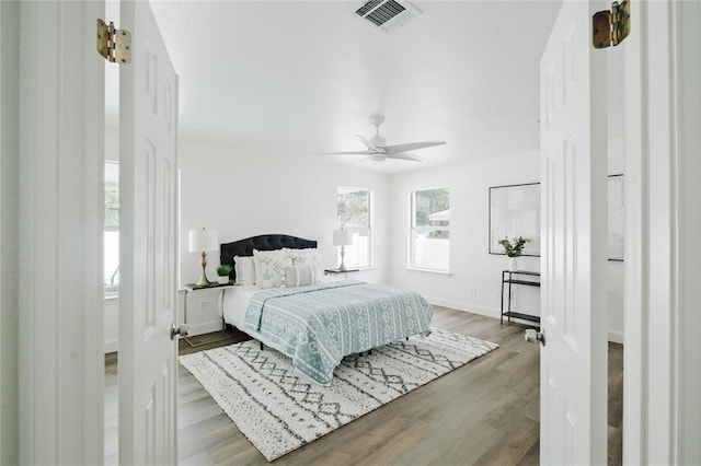 bedroom featuring ceiling fan and light wood-type flooring