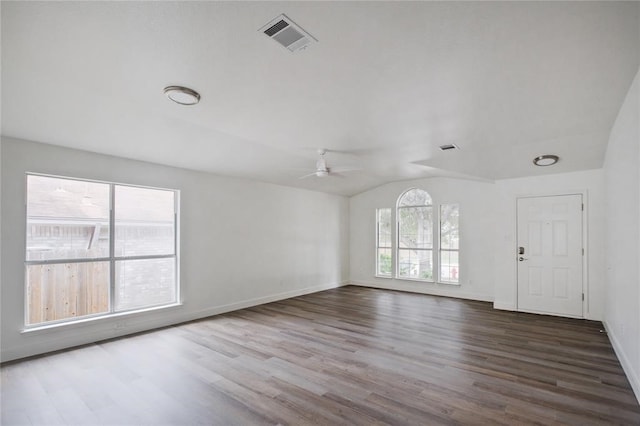 empty room featuring ceiling fan, lofted ceiling, and wood-type flooring