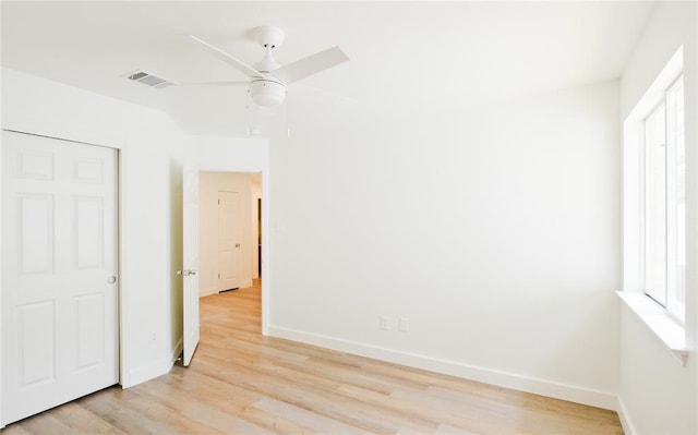 unfurnished bedroom featuring light wood-type flooring and ceiling fan