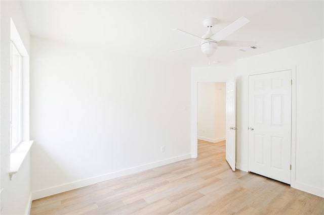 unfurnished room featuring light hardwood / wood-style floors and ceiling fan