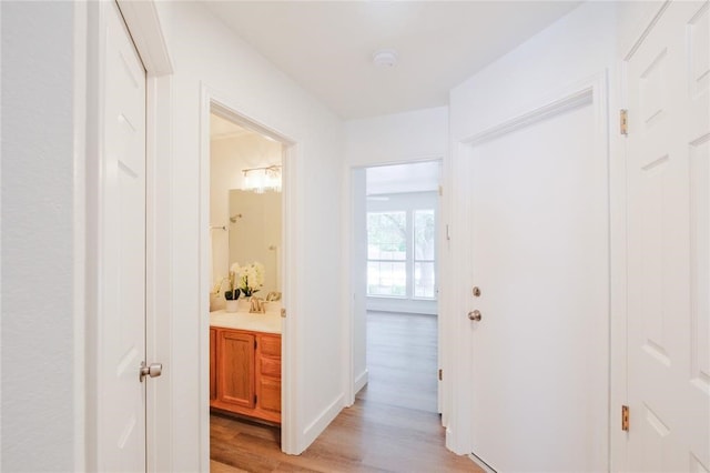 hallway featuring light wood-type flooring