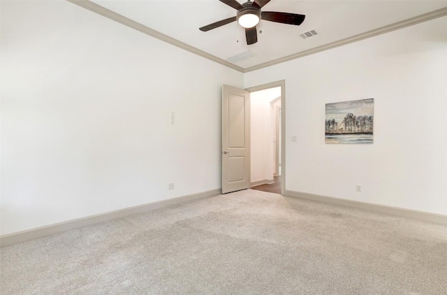 unfurnished room with ceiling fan, ornamental molding, and light carpet