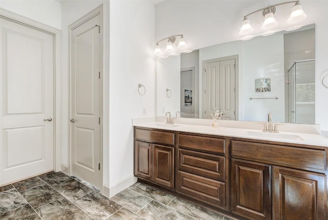 bathroom featuring walk in shower and vanity