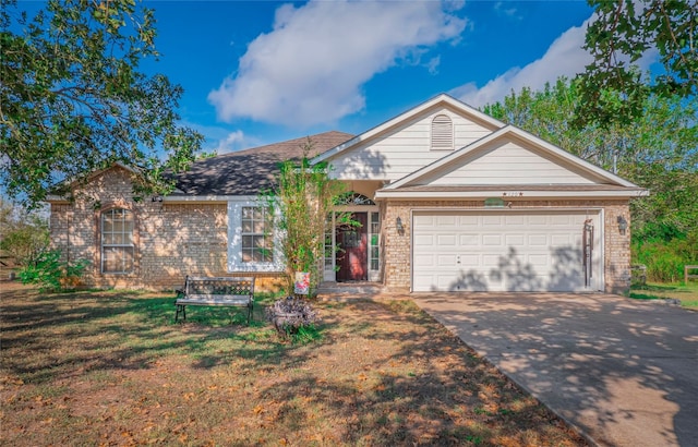 single story home featuring a front lawn and a garage