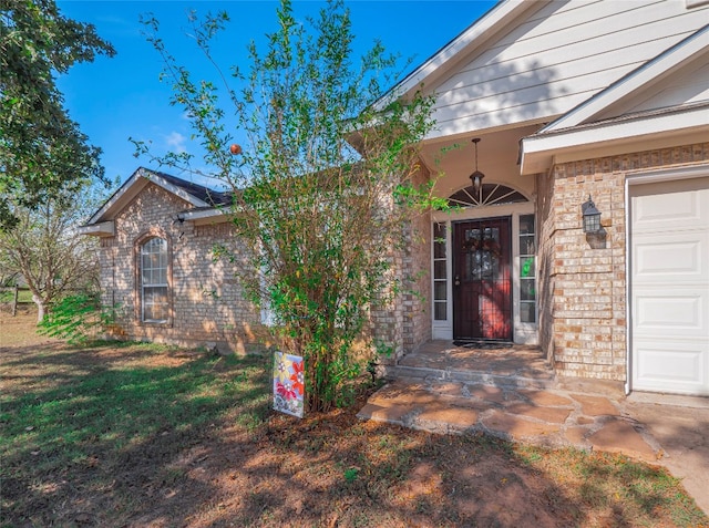 entrance to property featuring a garage