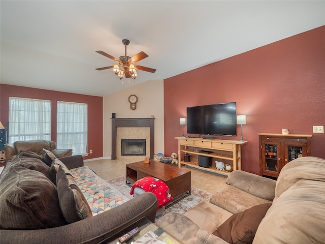 living room featuring a fireplace, vaulted ceiling, and ceiling fan