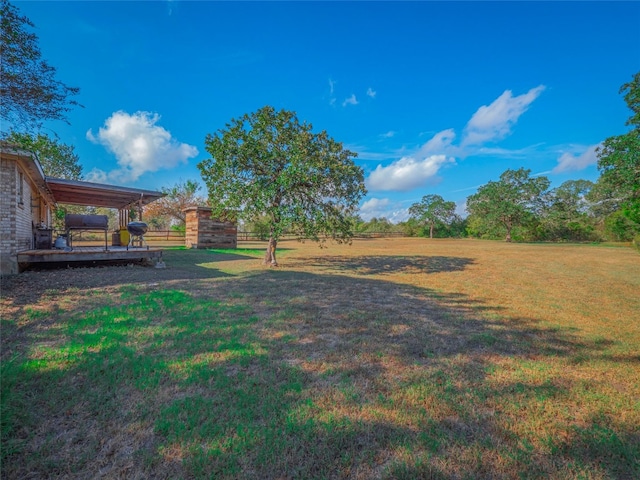 view of yard featuring a wooden deck