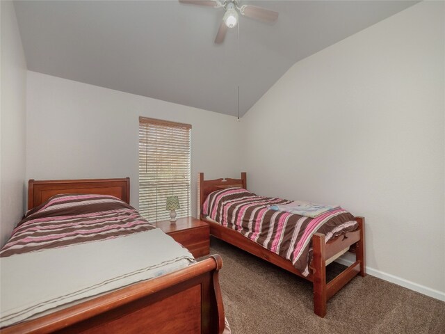 carpeted bedroom featuring ceiling fan and lofted ceiling