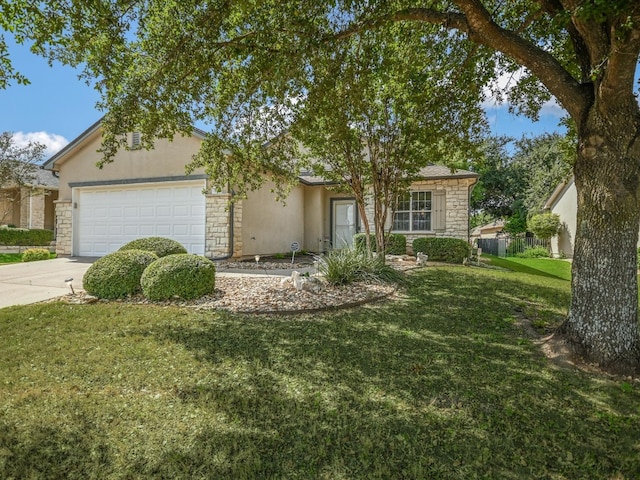 single story home featuring a garage and a front lawn