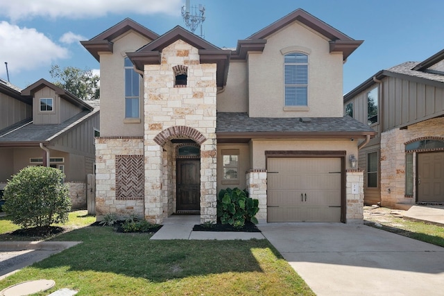 view of front of property featuring a front lawn and a garage