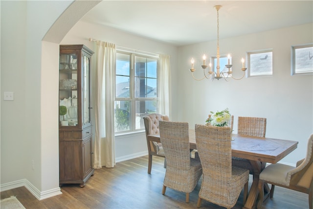 dining area featuring a chandelier and hardwood / wood-style flooring