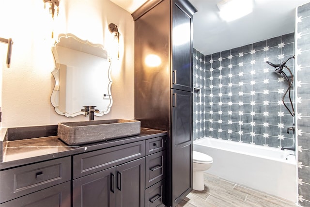 full bathroom featuring  shower combination, vanity, and toilet