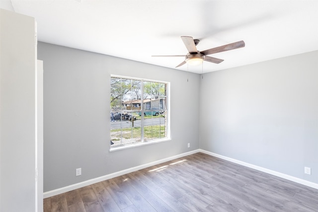 spare room featuring ceiling fan and wood-type flooring